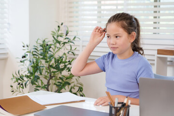 Caucasian preteen girl raising hand classroom answering question during study assignment teamwork...