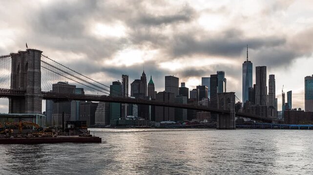 Brooklyn Bridge and Lower Manhattan with Moody Clouds and Boat Traffic Timelapse