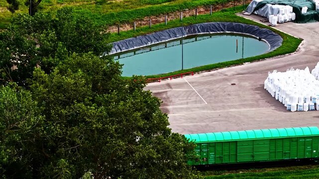 Liquid fertilizers urea based large storage pond stacks of white bags urea prills factory