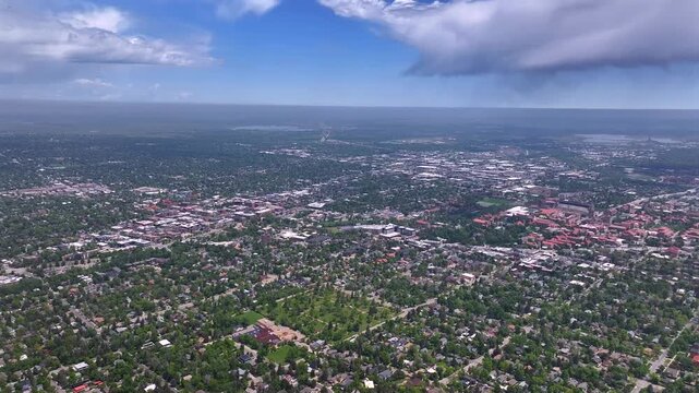 Front range town of Boulder Colorado college University city summer spring aerial drone Pearl Street Mall Eben G Fine Park Boulder creek Chautauqua Park Flatirons Green mountain blue sky sunny forward