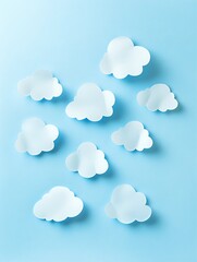 Fototapeta premium White paper cut clouds arranged on light blue background, creating minimalist design with soft shadows and copy space for text