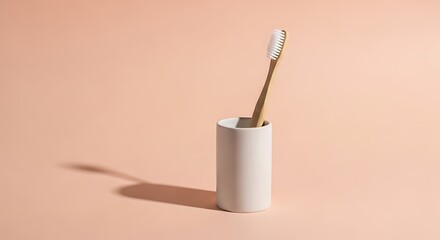 Solitary Bamboo Toothbrush in a White Holder with a Long, Crisp Morning Shadow.