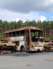 Burned-out buses and cars on a lot