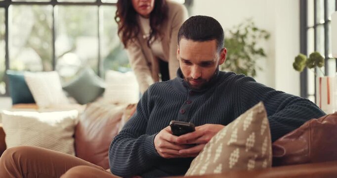 Man, fight and ignore with phone on sofa for argument, disagreement or conflict in home. Frustrated couple, woman and separation with mobile smartphone for living room dispute or cheating affair