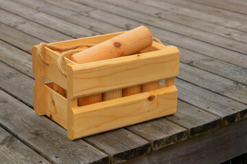 A Molkky game set outdoors in the wooden box, wooden sticks, the casual, social and fun Finnish...