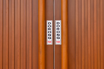 PUSH sign on wooden door