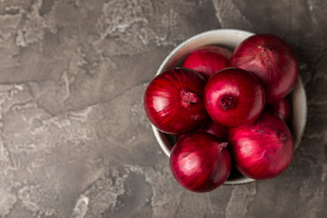 Shallot onion on the kitchen table. onion slice. onion rings. Fresh red Onion. Natural, fresh, vegetarian food. Agricultural products. Healthy eating. Vegetables. Farmer's market.