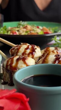 asian cuisine sushi cooking sushi at a culinary master class with a cheese cap use a torch sushi tempra baked rolls in batter and breadcrumbs with avocado the whole cooking process step by step