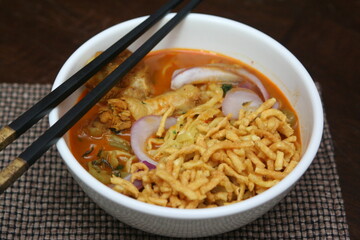 Northern Thai food Khao Soi, a spicy Thai dish consisting of noodles and a delicious curry and...