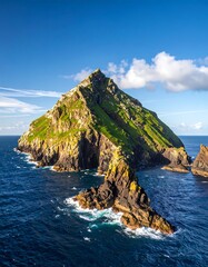 Picturesque island peak with vibrant green slopes