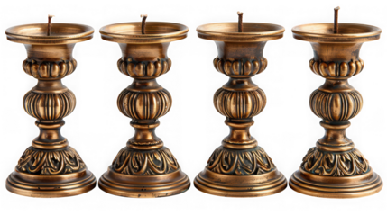 Four ornate antique bronze candle holders with intricate carvings, isolated on transparent background