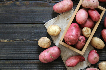 Fresh Young potatoes on a wooden background