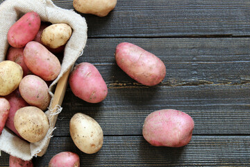 Fresh Young potatoes on a wooden background