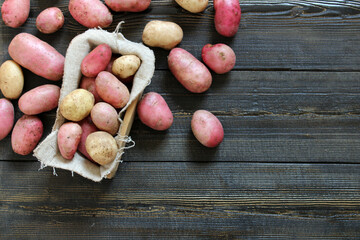 Fresh Young potatoes on a wooden background