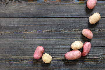Fresh Young potatoes on a wooden background
