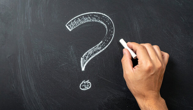 White question mark drawn with chalk on blackboard, isolated. Hand holding chalk, FAQ and Q&A