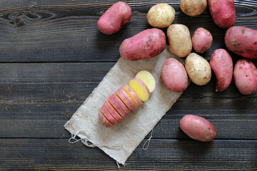 Fresh Young potatoes on a wooden background