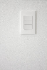 Close-up of a white wall and switch