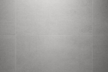
The wall is made of gray tiles.