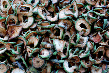 dried, sliced ​​green pears with the skin and cores cut out, spread out on the surface