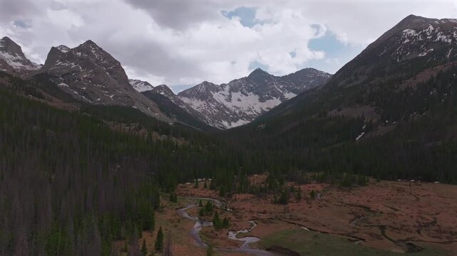 Huerfano River valley Blanca Peak Mt Mount Lindsey Lily Lake trail Sangre de Cristo Range Colorado aerial drone spring Summer San Isabel forest Iron Nip ple Rocky Mountains gray clouds forward pan up