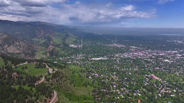 Front range town of Boulder Colorado summer spring aerial drone Chautauqua Park Flatirons Green mountain Pearl Street Mall Eben G Fine Park Boulder creek college University blue sky sunny forward pan
