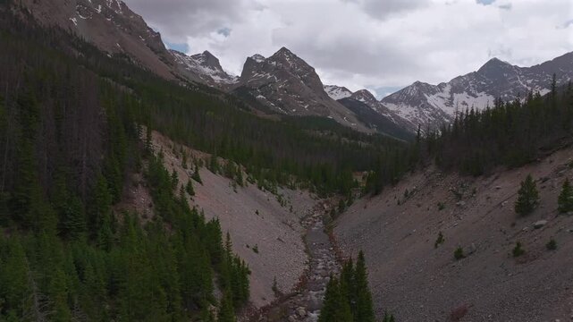 Huerfano River valley Blanca Peak Mt Mount Lindsey Lily Lake trail Sangre de Cristo Range Colorado aerial drone spring Summer San Isabel forest Iron Nip ple Rocky Mountains snow melt gray clouds up