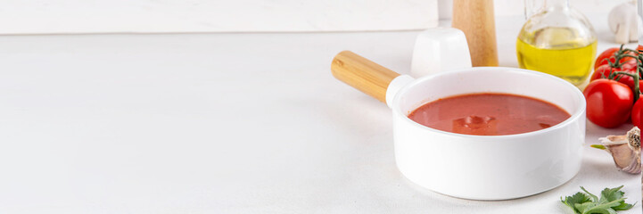 Tasty tomato cream soup. Delicious hot fall season gazpacho creamy pureed soup with garlic and aromatic herbs. Autumn and winter comfort food, tasty vegan vegetable recipe