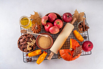 Fall baking, cooking seasonal dessert background with various ingredients - honey, pumpkin squash,...