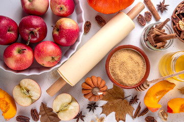 Fall baking, cooking seasonal dessert background with various ingredients - honey, pumpkin squash,...