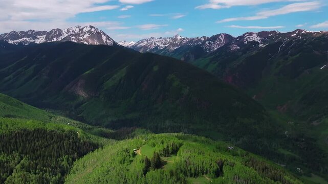Aspen Mountain Ajax Little Annie Trailhead aerial drone Colorado Conundrum creek trail Castle Peak 14er Rocky Mountains Elk Range Aspen Trees spring summer morning blue sky clouds forward pan up