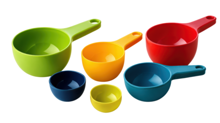 Colorful measuring cups in various sizes on a white isolate background.