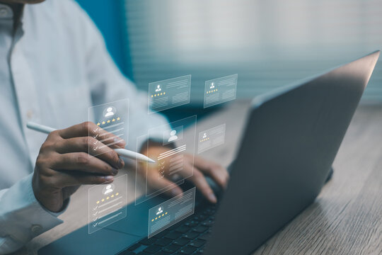 Businessman analyzing digital profile with rating and review system on virtual screen,Concepts of HR recruitment, customer feedback, online survey, and digital evaluation