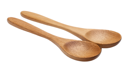 Two wooden spoons on a white isolated background, perfect for culinary and kitchen-related themes.