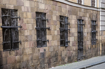 Historic Stone Wall with Iron-Barred Windows in Stockholm