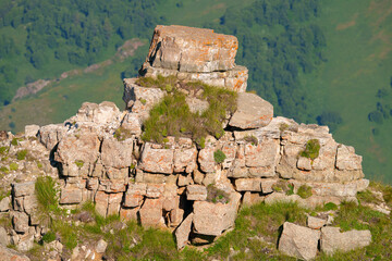 A panoramic aerial view of mountains, hills, gorges of the Northern Caucasus covered with greenery...