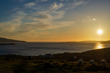 Scenic Sunset Over Isle of Skye Coastline with Grazing Sheep