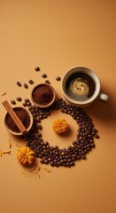 A coffee cup with beans, cinnamon, and flowers arranged on a brown colored surface in studio shot