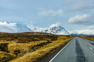 Scenic Road Through Snow-Capped Glencoe Highlands, Scotland