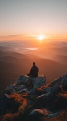 Sunrise view from peak, person meditating