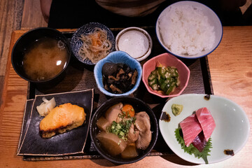 Traditional japanese street food lunch set with rice meat fish and vegetable fruit salad and miso...