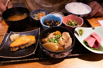 Traditional japanese street food lunch set with rice meat fish and vegetable fruit salad and miso soup and side dish in local restaurant cafe shop for travelers people eat drink at Tokyo city in Japan
