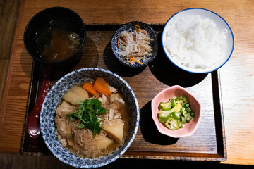 Traditional japanese street food lunch set with rice meat fish and vegetable fruit salad and miso...