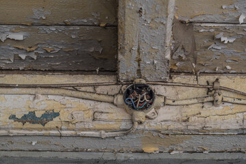 
JUNCTION BOX - An antiquated surface electrical installation on a wooden building structure