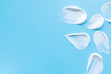 A smear of cream on a light background. Beauty concept.