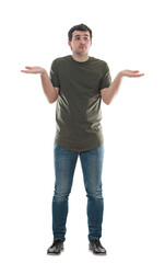 Young man spreads arms confused what to choose. Male shrugs shoulders puzzled and undecided. Difficult choice concept with full length model isolated on transparent background