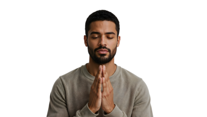 Serene young man meditating with closed eyes and hands in prayer gesture isolated on the transparent background
