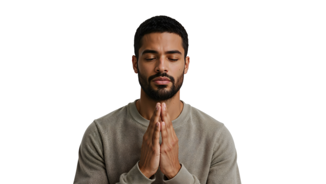 Serene young man meditating with closed eyes and hands in prayer gesture isolated on the transparent background