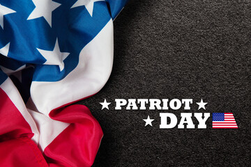 Patriot Day inscription with USA flag on black textured background. 09.11.2001 American Patriot Day.