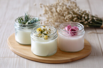 Crafting handmade candles with floral decorations at a workshop